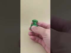 Tampa lisa de plástico verde com botão para frascos cosméticos