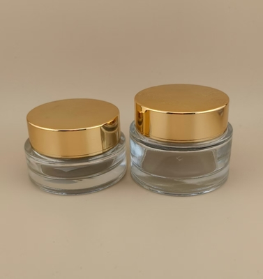 Frasco de creme de vidro transparente com tampa de rosca dourada para loção feminina