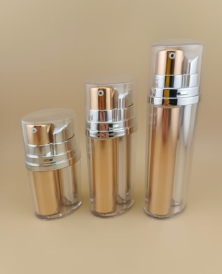 Frasco de bomba sem ar dourado e prateado de duas cores com revestimento externo para produtos cosméticos e de cuidados com a pele